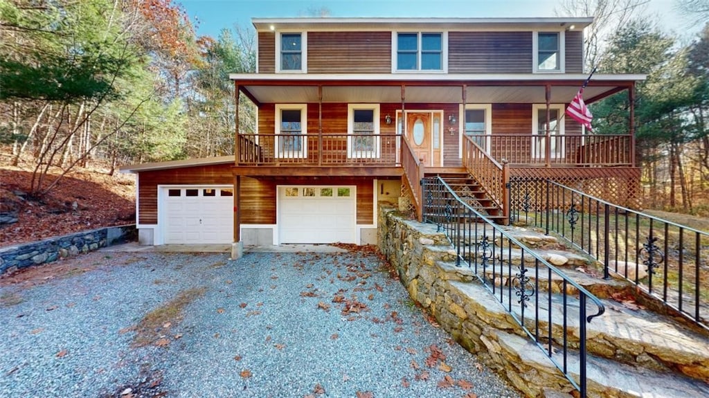 view of front of property featuring a garage and covered porch