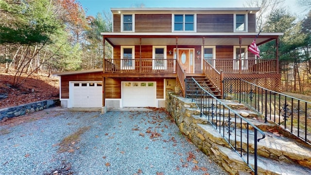 view of front of property featuring a garage and covered porch