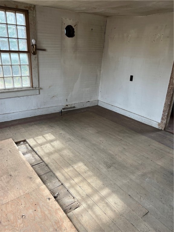 spare room with light hardwood / wood-style flooring