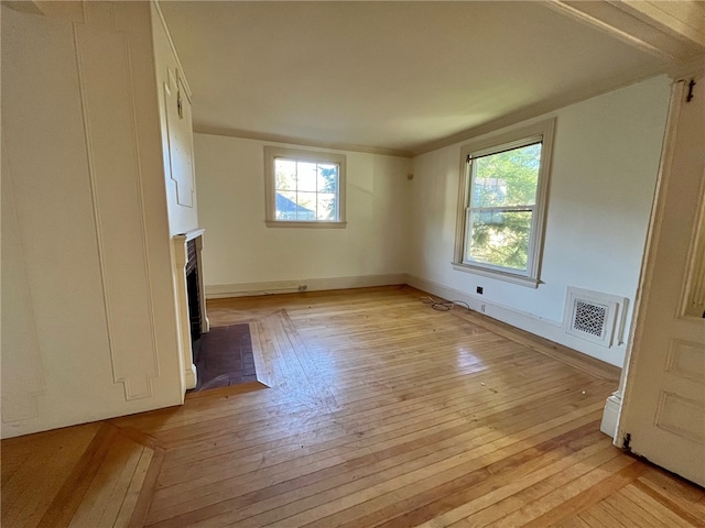 unfurnished living room featuring light hardwood / wood-style floors