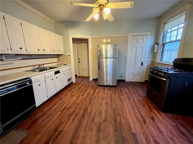 kitchen featuring black appliances, sink, dark hardwood / wood-style floors, ceiling fan, and white cabinetry