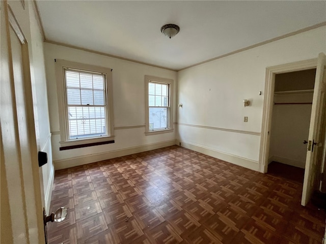 unfurnished bedroom featuring dark parquet floors