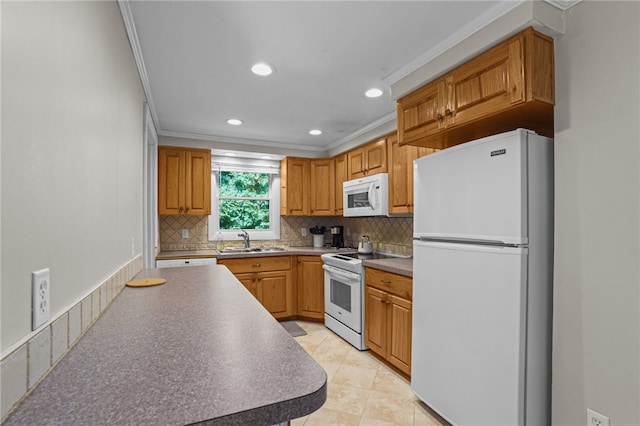 kitchen featuring light tile patterned floors, white appliances, sink, and ornamental molding