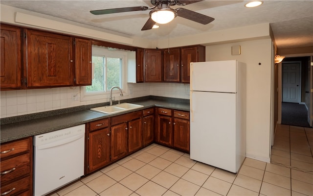 kitchen with sink, ceiling fan, light tile patterned flooring, backsplash, and white appliances