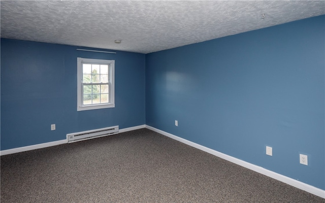 spare room featuring a baseboard radiator, a textured ceiling, and carpet