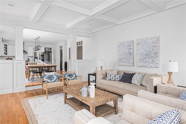 living room featuring light wood-type flooring, beam ceiling, and coffered ceiling