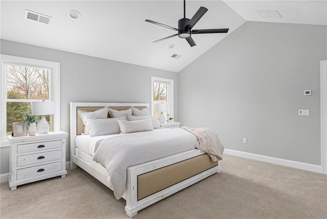 carpeted bedroom with vaulted ceiling and ceiling fan