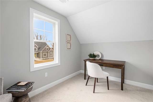 carpeted office with vaulted ceiling