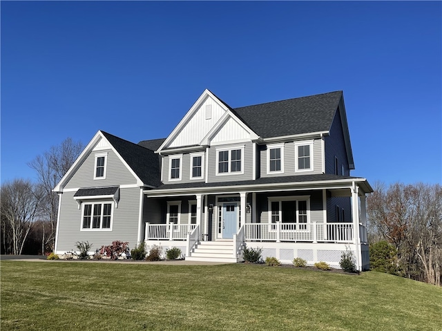 view of front of home featuring a front lawn and covered porch