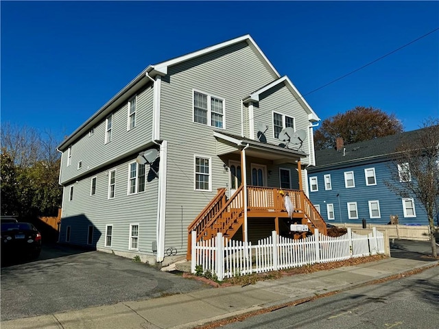 21 Grant St, Providence, RI 02909 - view of front of home with a fenced front yard and stairs