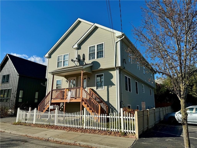 21 Grant St, Providence, RI 02909 - view of front of house featuring covered porch, stairs, and a fenced front yard