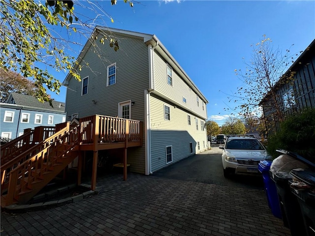 21 Grant St, Providence, RI 02909 - rear view of house with a wooden deck and stairway