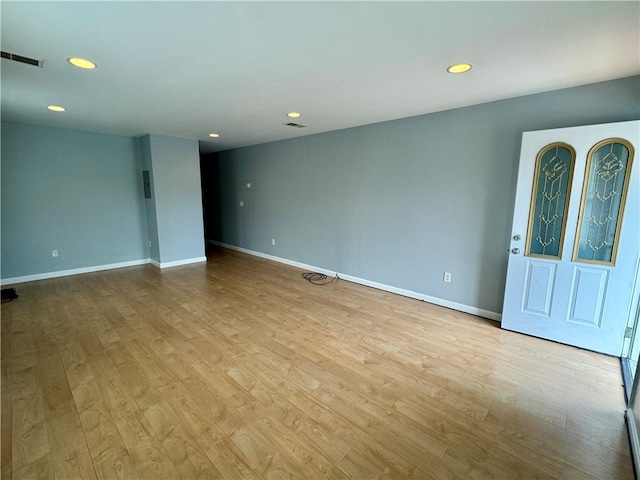 spare room featuring light hardwood / wood-style flooring