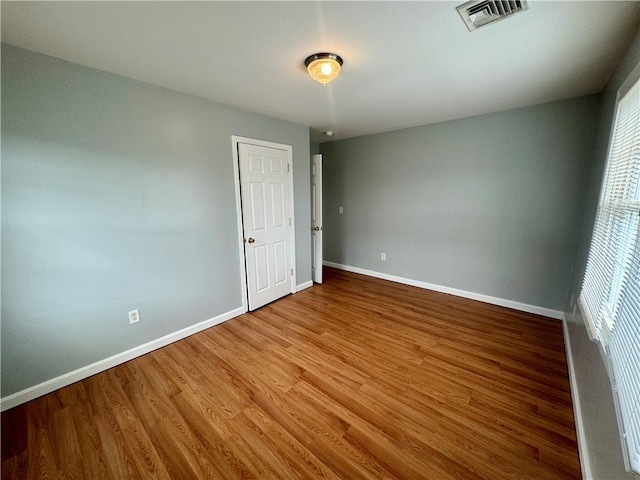 unfurnished bedroom with wood-type flooring