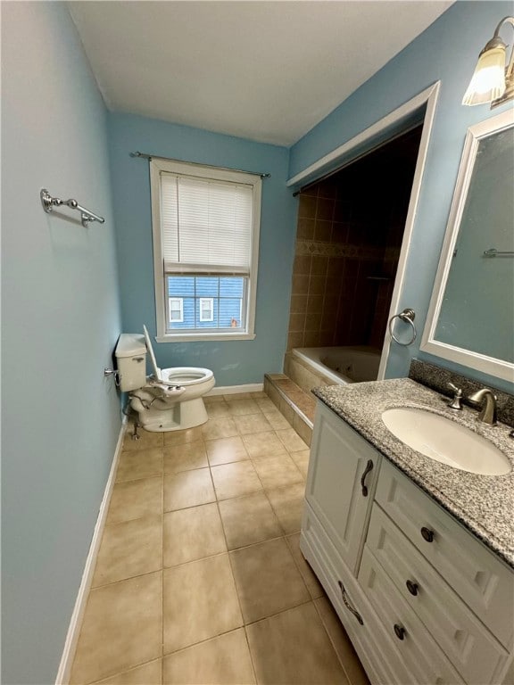 bathroom featuring toilet, vanity, and tile patterned floors