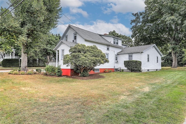 view of home's exterior featuring a yard