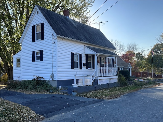 view of property exterior featuring a porch