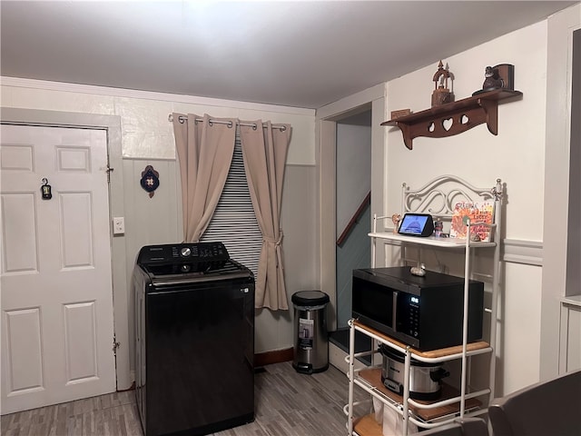 interior space with light wood-type flooring and washer / clothes dryer