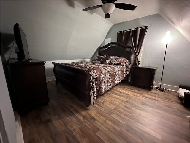 bedroom featuring hardwood / wood-style floors, ceiling fan, and lofted ceiling