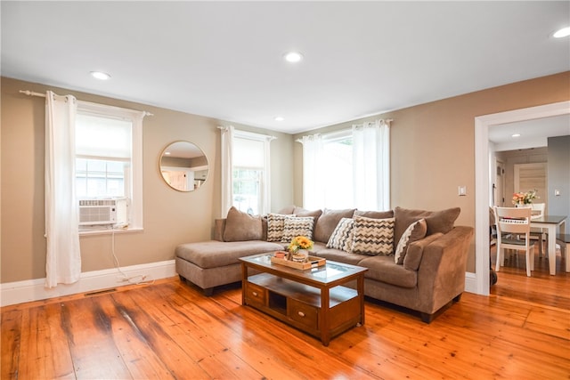 living room featuring hardwood / wood-style floors and cooling unit