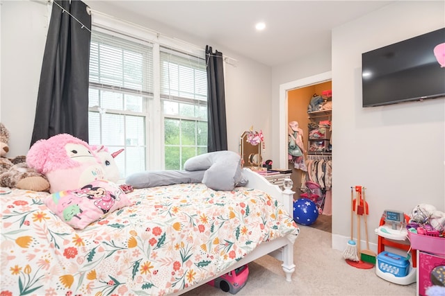 bedroom with carpet flooring and a closet