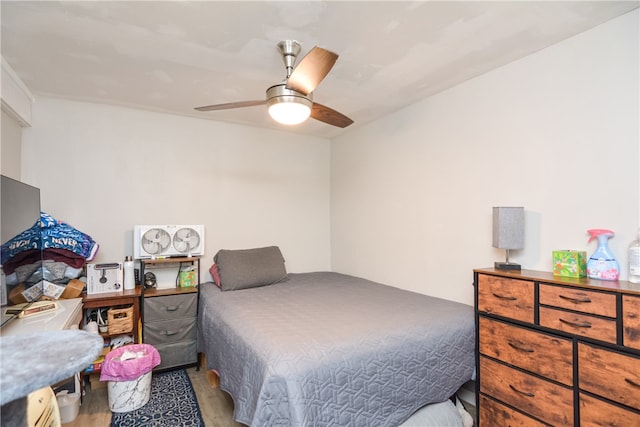 bedroom with ceiling fan and light wood-type flooring