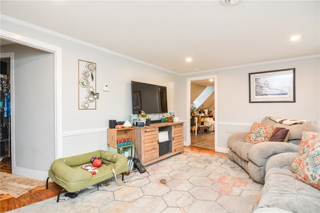 living room with light hardwood / wood-style flooring and ornamental molding