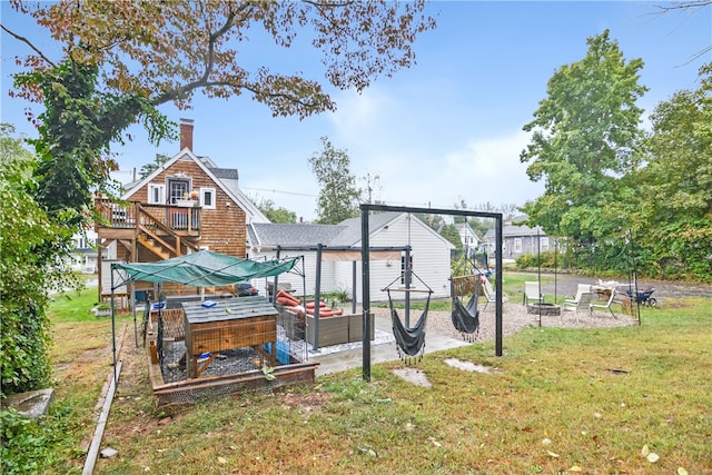 view of yard with a wooden deck and a patio area