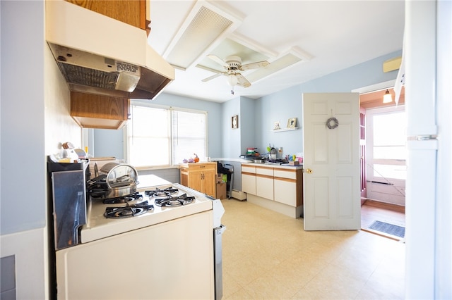 kitchen with ventilation hood, ceiling fan, and white gas stove