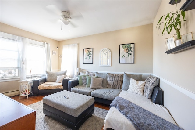 living room with ceiling fan, a baseboard radiator, and dark hardwood / wood-style flooring