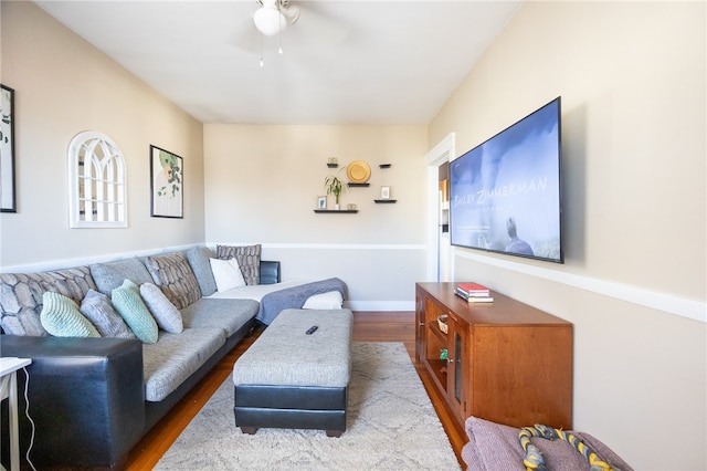 living room featuring hardwood / wood-style flooring and ceiling fan