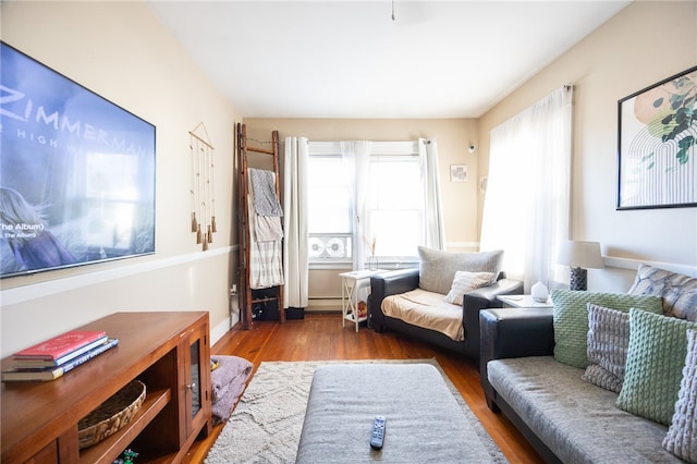 living room featuring hardwood / wood-style flooring and a baseboard radiator