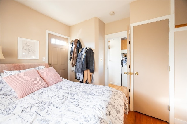 bedroom with a closet and wood-type flooring