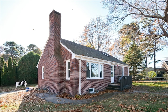 view of property exterior with a deck