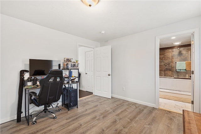 office space with light hardwood / wood-style floors