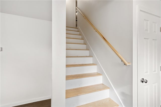 stairway featuring hardwood / wood-style flooring