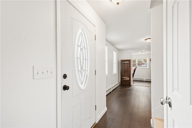 foyer with dark wood-type flooring and a baseboard radiator