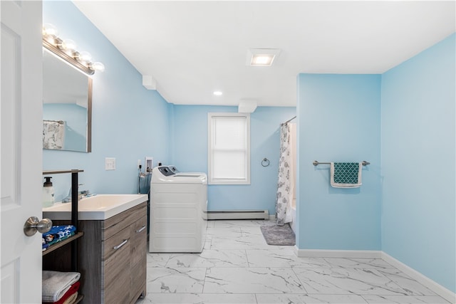 bathroom featuring vanity, a shower with shower curtain, baseboard heating, and washer and dryer