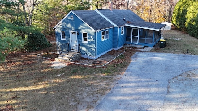 view of front of property featuring a sunroom