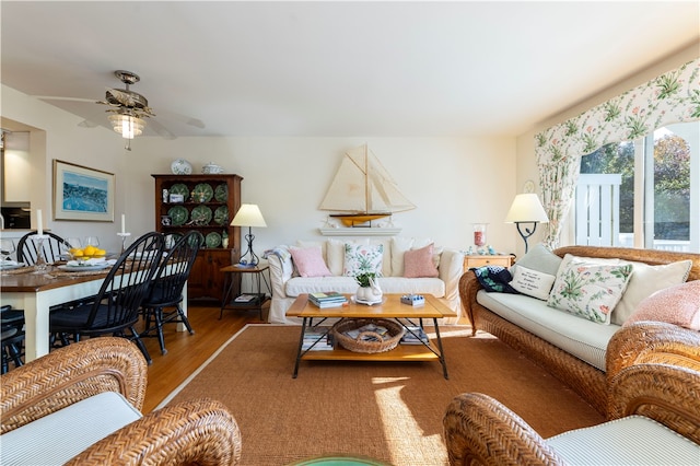 living room with hardwood / wood-style floors and ceiling fan