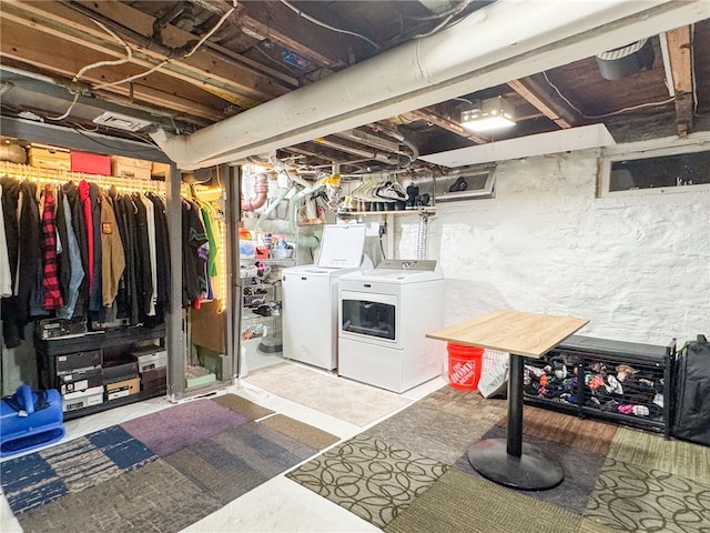 basement with washer and clothes dryer