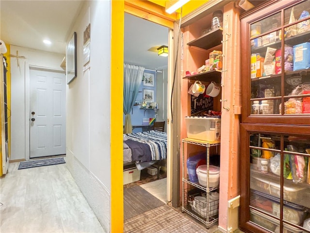 hall with hardwood / wood-style flooring