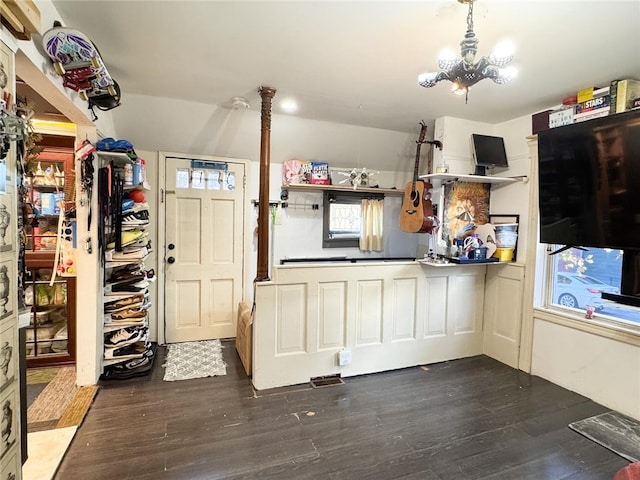 kitchen featuring a chandelier and dark hardwood / wood-style flooring