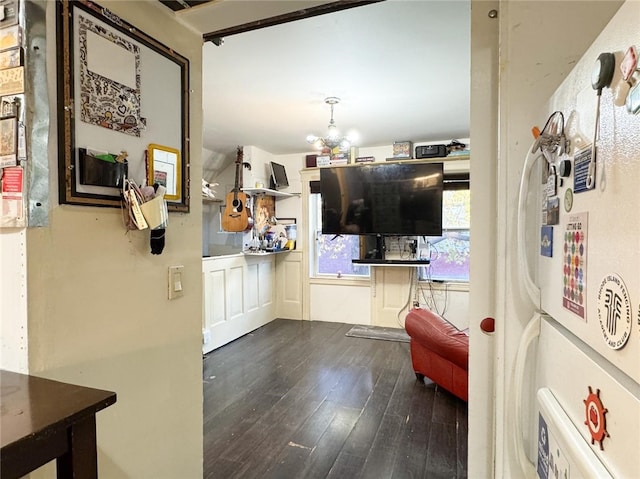 kitchen with hardwood / wood-style flooring and a chandelier