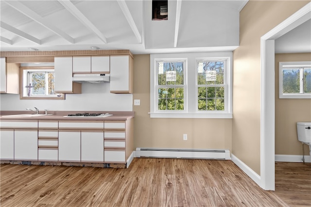 kitchen with a baseboard heating unit, sink, light hardwood / wood-style flooring, vaulted ceiling with beams, and white cabinetry