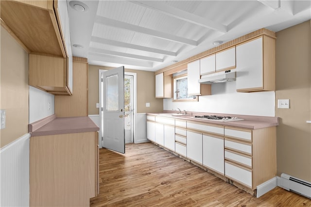 kitchen with baseboard heating, white gas cooktop, sink, and light hardwood / wood-style flooring