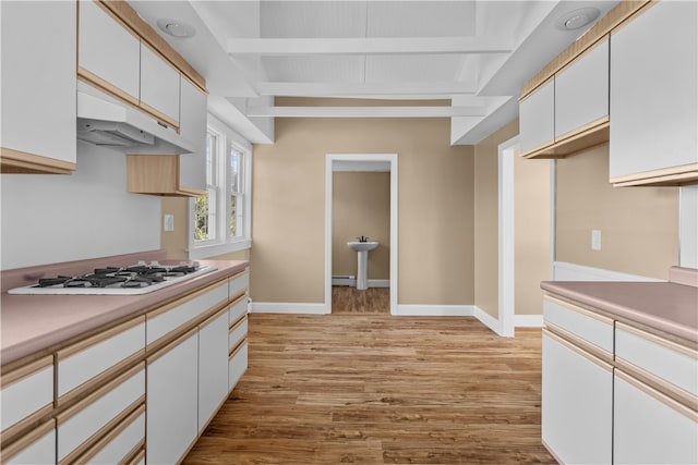 kitchen with white gas cooktop, white cabinets, and light hardwood / wood-style floors