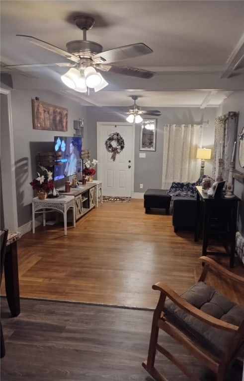 living room with ceiling fan and hardwood / wood-style floors