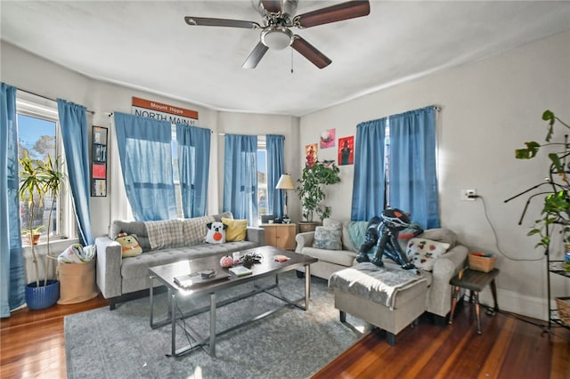 living room featuring hardwood / wood-style floors and ceiling fan