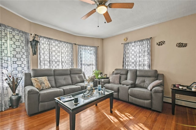 living room with hardwood / wood-style flooring and ceiling fan